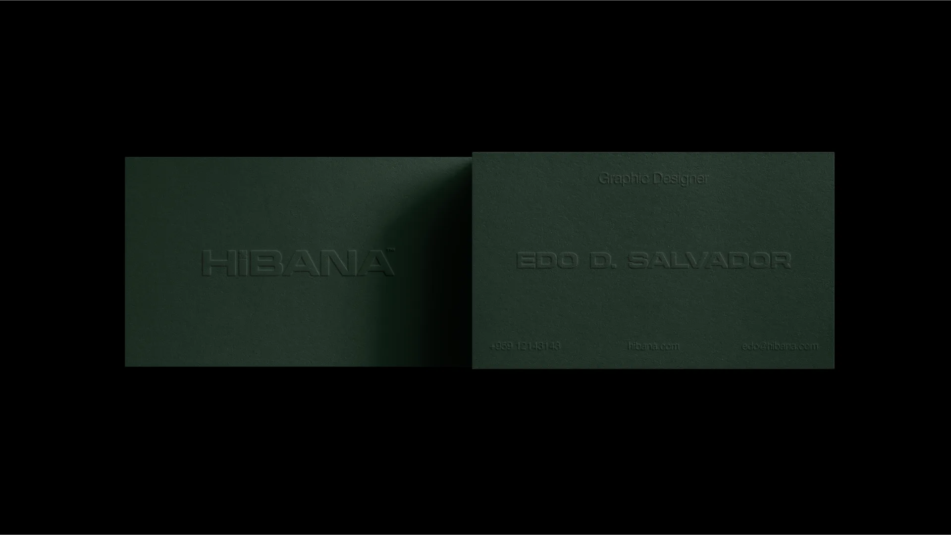 A glowing Hibana lightbox sign on a concrete plinth in the dark